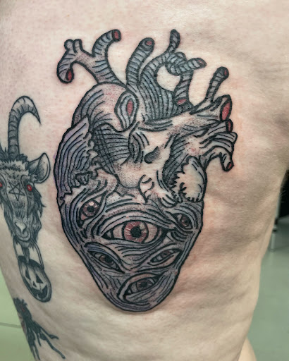 Explore snoopy tattoo ideas, creative tattoo ideas in Cincinnati, available at Opal Moon Tattoo