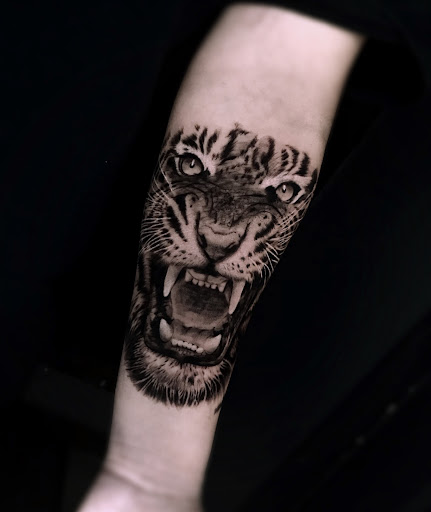 Explore throat tattoo ideas for males, creative tattoo ideas in Corona, available at Crop Circles Tattoo Studio