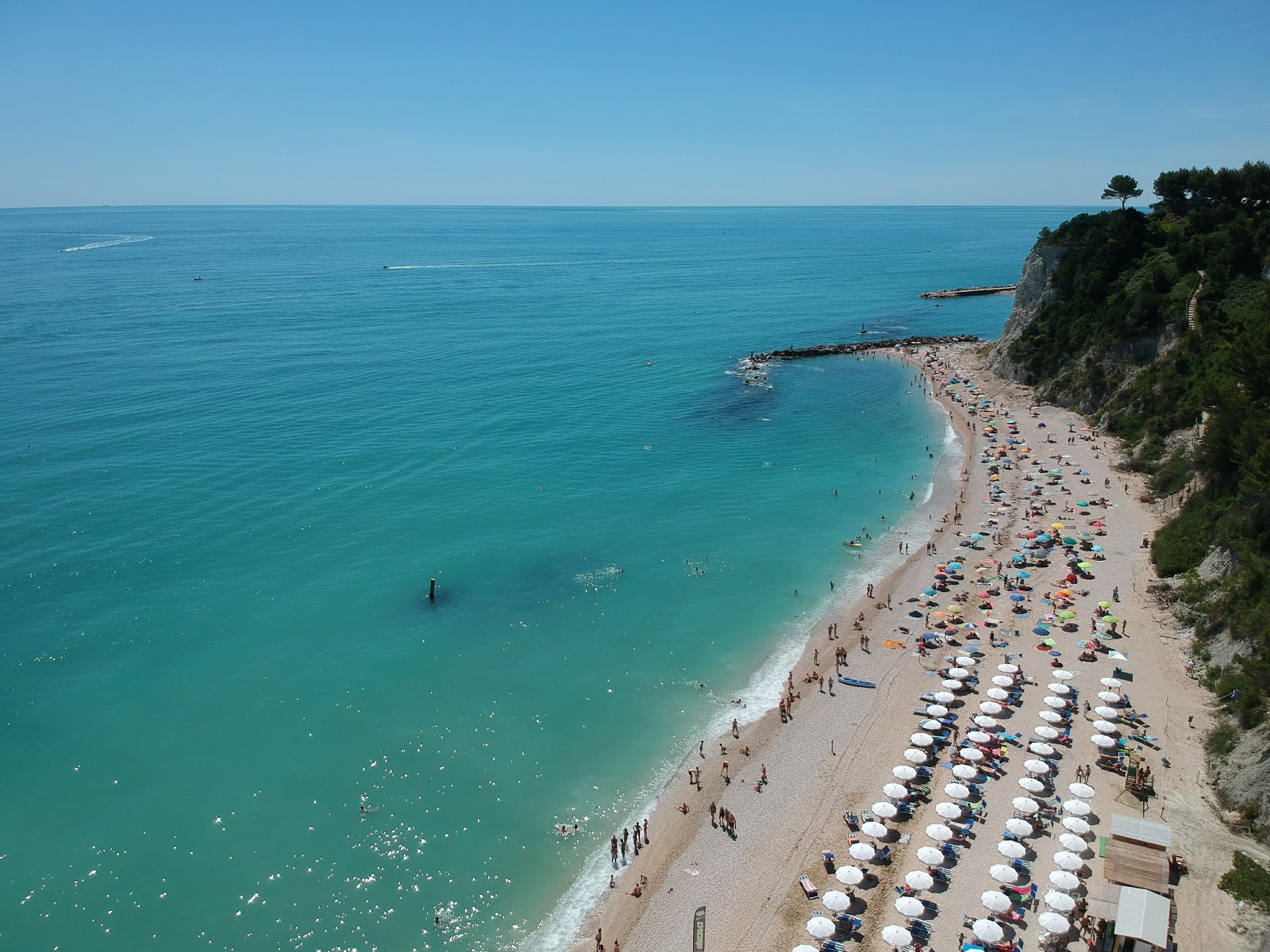 Photo of San Michele Beach backed by cliffs