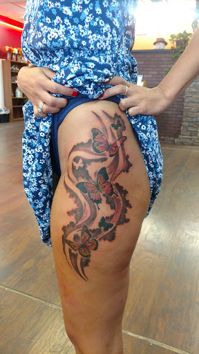 Explore small lion tattoo ideas, creative tattoo ideas in El Paso, available at House of Pain Tattoo & Body Piercing Studios