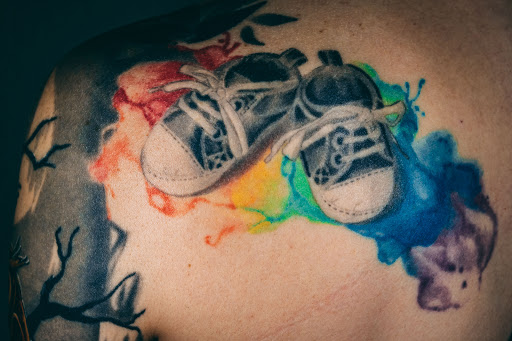 Explore black queen tattoo ideas, creative tattoo ideas in Brighton, available at Branch Out Studios - Tattoo & Piercing Lounge