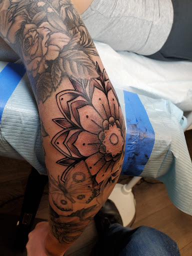 Explore tattoo son ideas, creative tattoo ideas in Peoria, available at Guerrilla Ink Tattoos