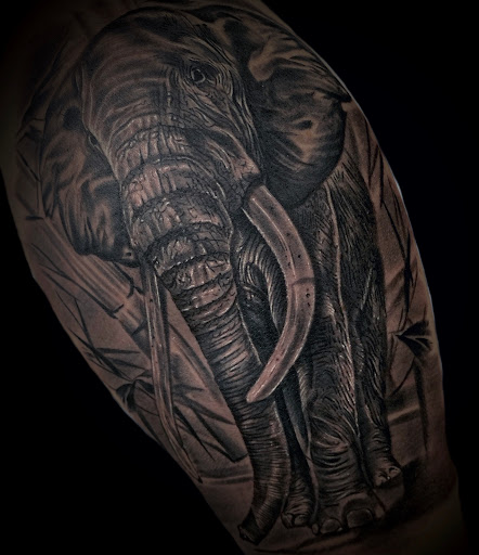 Explore full neck tattoo ideas for men, creative tattoo ideas in Altoona, available at Catharsis Tattoo Gallery