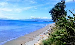 Foto di Pakawau Beach sorretto da scogliere