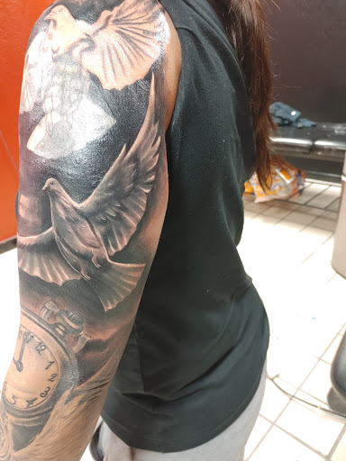 Explore cover up tattoo ideas for leg, creative tattoo ideas in Hereford, available at Slow Pain Tattoo Body Art Studio