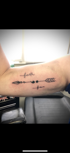 Explore karma tattoo ideas for men, creative tattoo ideas in Warrensburg, available at Altered Visions Tattoo Studio