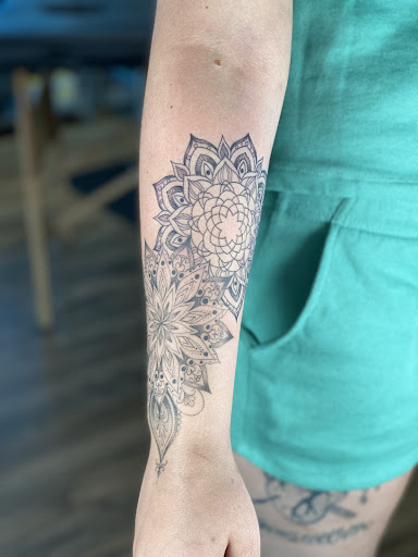 Explore women's sternum tattoo ideas, creative tattoo ideas in Sound Beach, available at Fine Line Willy Tattoo