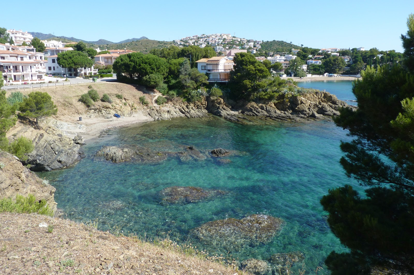 Foto di Cala De L'Alguer con una superficie del sabbia beige