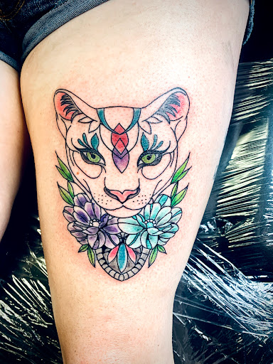 Explore feminine chest tattoo ideas, creative tattoo ideas in Lake City, available at Crooked Spines Tattoo Studio