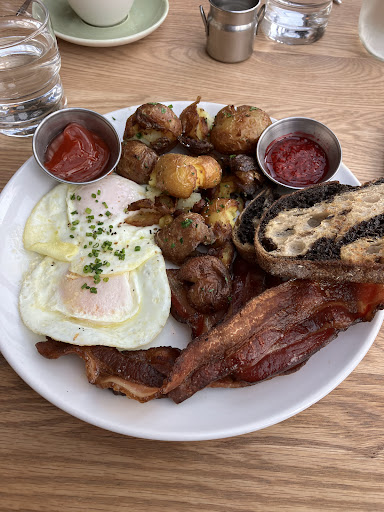 Bacon 🥓 eggs 🍳 potatoes, hearty bread homemade raspberries jam 