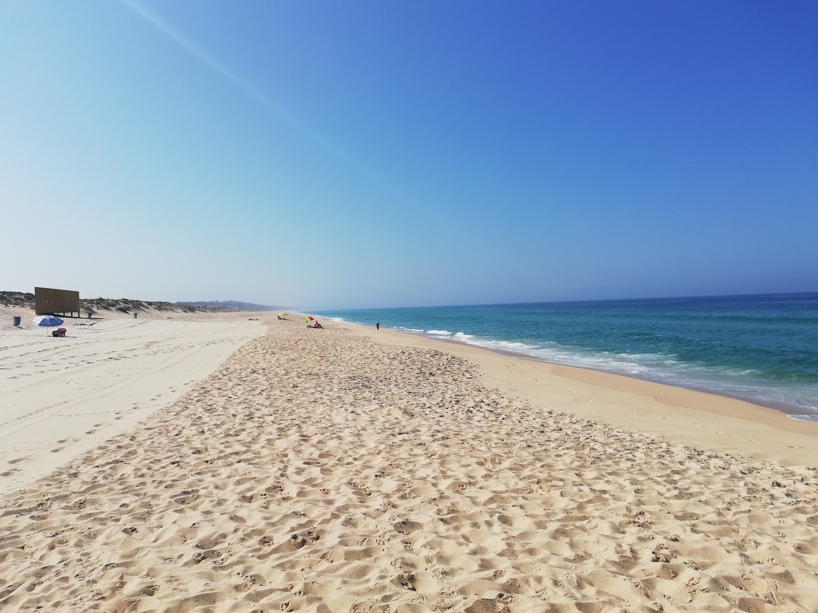Foto di Praia do Pego con una superficie del sabbia bianca