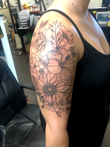 Explore male flower tattoo ideas, creative tattoo ideas in Wahiawa, available at Rising Tide Tattoo