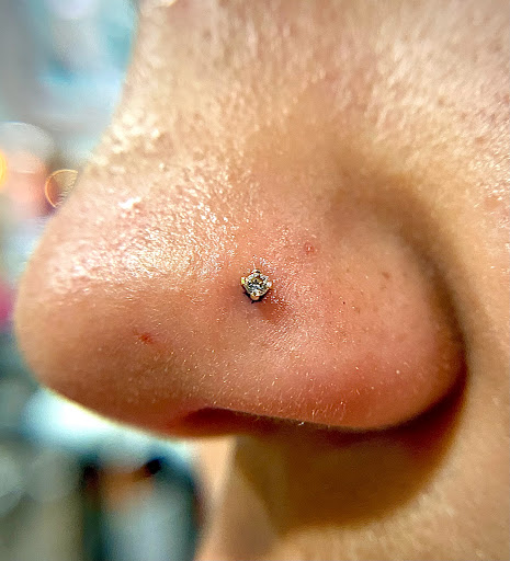 Explore astronomy tattoo ideas, creative tattoo ideas in Orange, available at Symbiosis Body Piercing