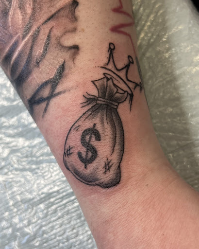 Explore pink ribbon tattoo ideas, creative tattoo ideas in Buffalo, available at True Gloom Tattoo Studio