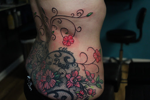 Explore tattoo ideas for women's lower back, creative tattoo ideas in Homosassa, available at Citrus Tattoos