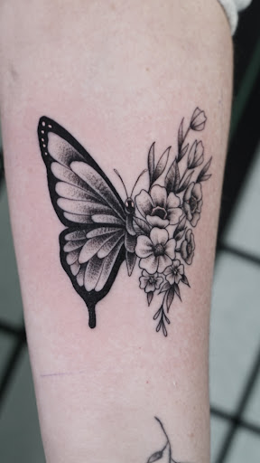 Explore march birth flower tattoo ideas, creative tattoo ideas in Arlington, available at Benchmark Tattoos