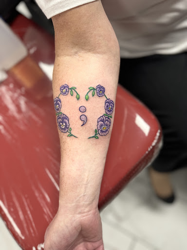 Explore women's thigh tattoo ideas, creative tattoo ideas in Plattsmouth, available at DreamWerks Tattoo Co