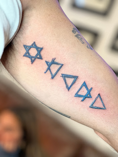 Explore wrap around wrist tattoo ideas, creative tattoo ideas in Scarsdale, available at Damm Nice Tattoo & Body Art