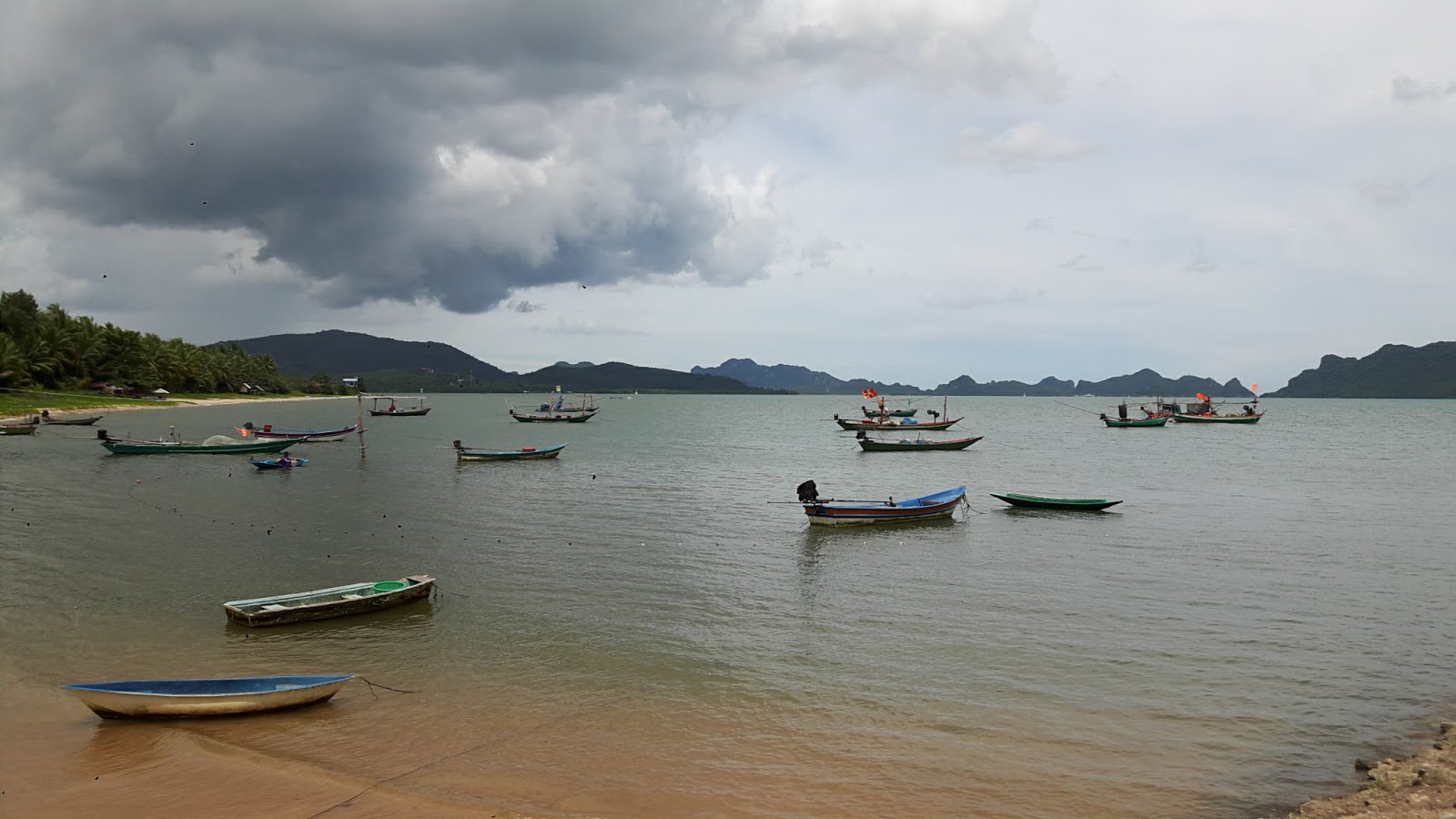 Photo of ThungMaHa Beach with dark blue water surface