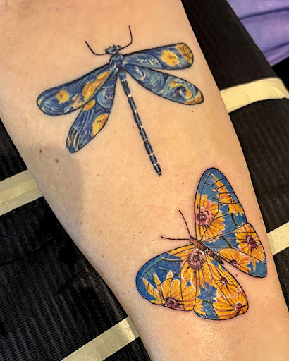 Find small tattoo between breast ideas for your next unique tattoo in Las Vegas at Club Tattoo