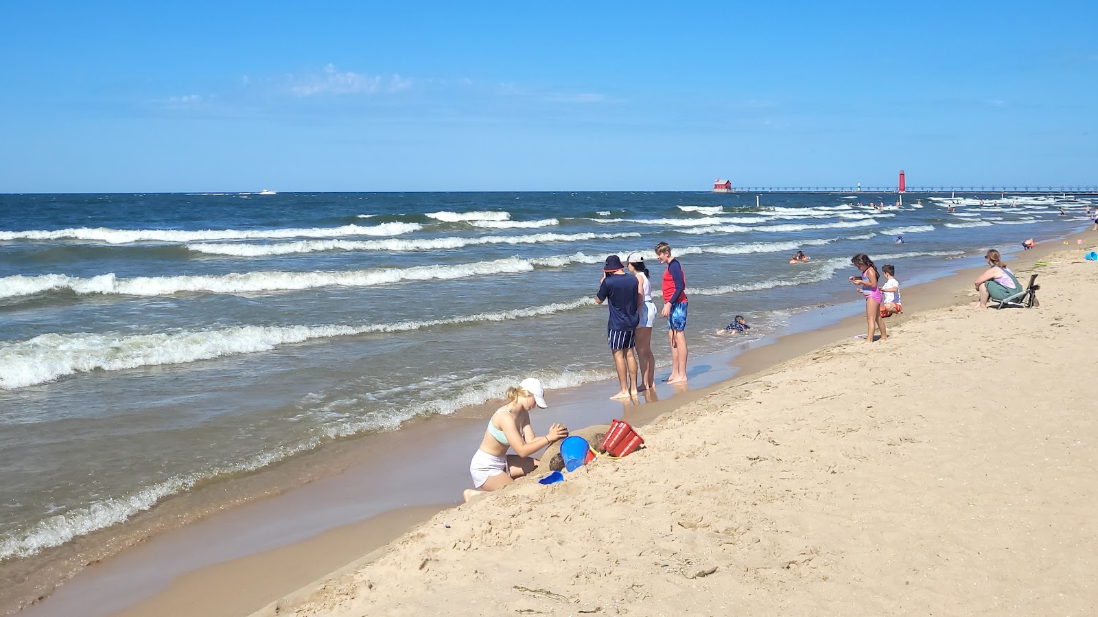 Photo of Grand Haven City Beach with turquoise pure water surface