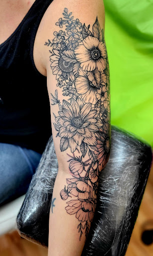 Explore female throat tattoo ideas, creative tattoo ideas in Benton, available at Spectrum Tattoo