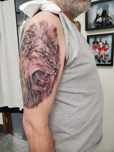 Find tattoo ideas for men 2024 for your next unique tattoo in Saint Paul at Iron Rhino Tattoo