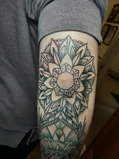 Explore karma tattoo ideas, creative tattoo ideas in Lakeview, available at Backwoods Tattoo Studio