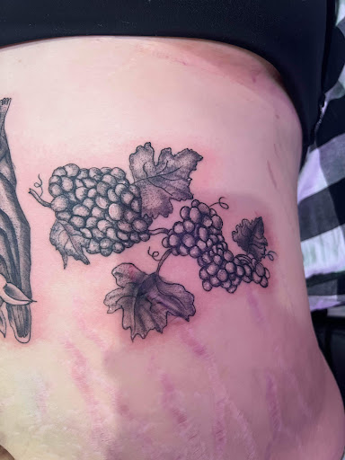 Explore ladies back tattoo ideas, creative tattoo ideas in Corning, available at Manifest Studios