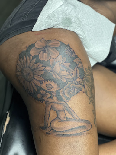 Explore small alien tattoo ideas, creative tattoo ideas in Jamaica, available at Rising Phoenix Ink