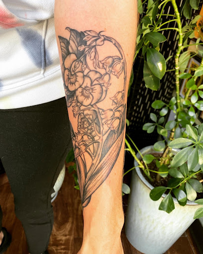Explore flower finger tattoo ideas, creative tattoo ideas in Lawrence, available at Standard Electric Tattooing