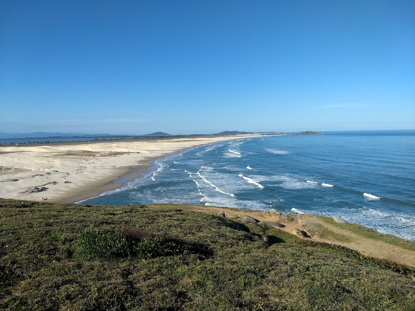 Foto von Praia da Galheta Sul mit feiner beiger sand Oberfläche