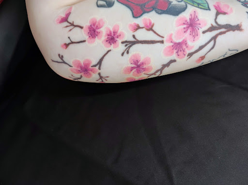 Explore rose tattoo idea, creative tattoo ideas in East Bend, available at Queen Bee Piercing and Tattoo