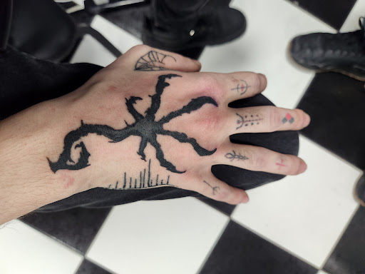 Explore hand tattoo ideas simple, creative tattoo ideas in Midlothian, available at Firehouse Tattoos