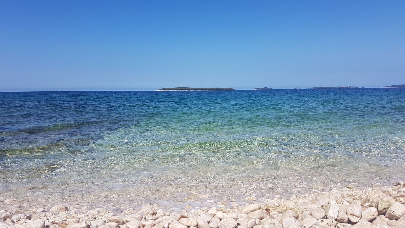 Foto van Coala beach met kleine baai