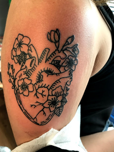 Explore thigh tattoo ideas, creative tattoo ideas in Dayton, available at Uppity Tattoos