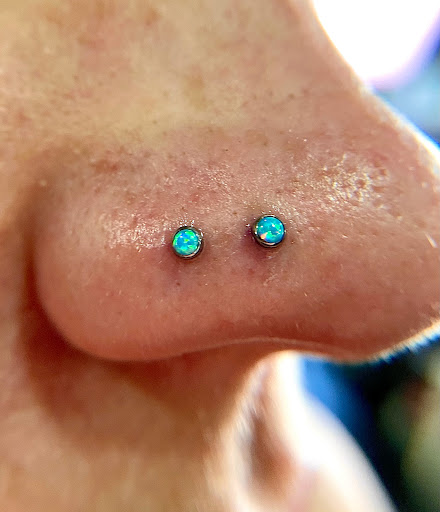 Explore tattoo ideas 2023, creative tattoo ideas in Orange, available at Symbiosis Body Piercing