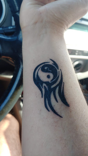 Explore massage therapy tattoo ideas, creative tattoo ideas in Orlando, available at Fine Ink Studios Tattoos