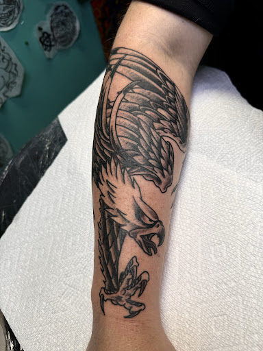 Explore butterfly flower tattoo ideas, creative tattoo ideas in Orange Park, available at Fantasy Tattoo and Piercing