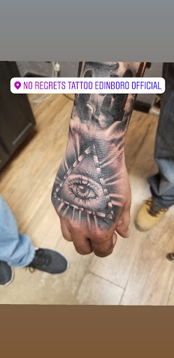 Explore tattoo scroll ideas, creative tattoo ideas in Edinboro, available at No Regrets Tattoo (Appointment Only)