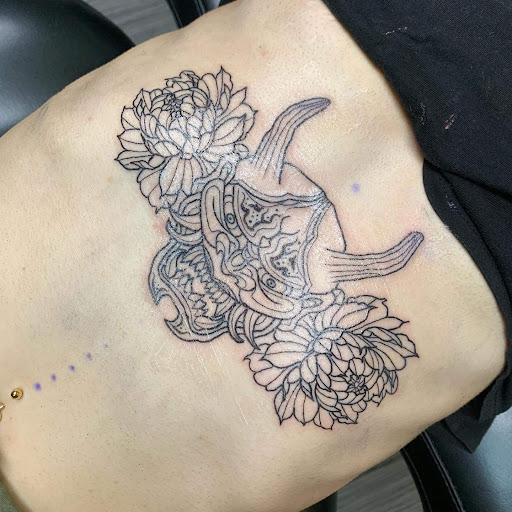 Explore circle tattoo cover up ideas, creative tattoo ideas in Chicago, available at Mind Crusher Tattoo