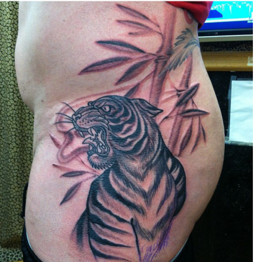 Explore pansy tattoo ideas, creative tattoo ideas in Clearwater, available at Moniques Body Art