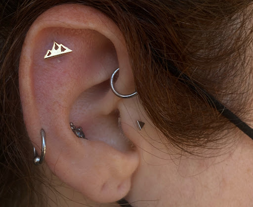 Explore book tattoos ideas, creative tattoo ideas in Costa Mesa, available at Barbella Studios