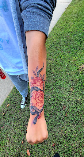 Explore word tattoo cover up ideas, creative tattoo ideas in Conway, available at Primal Urge Tattoos