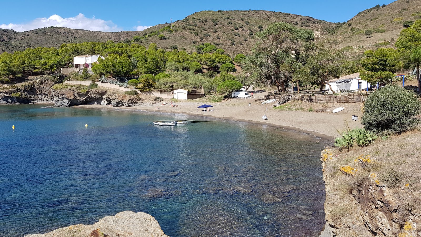 Photo of Cala Pelosa with turquoise pure water surface