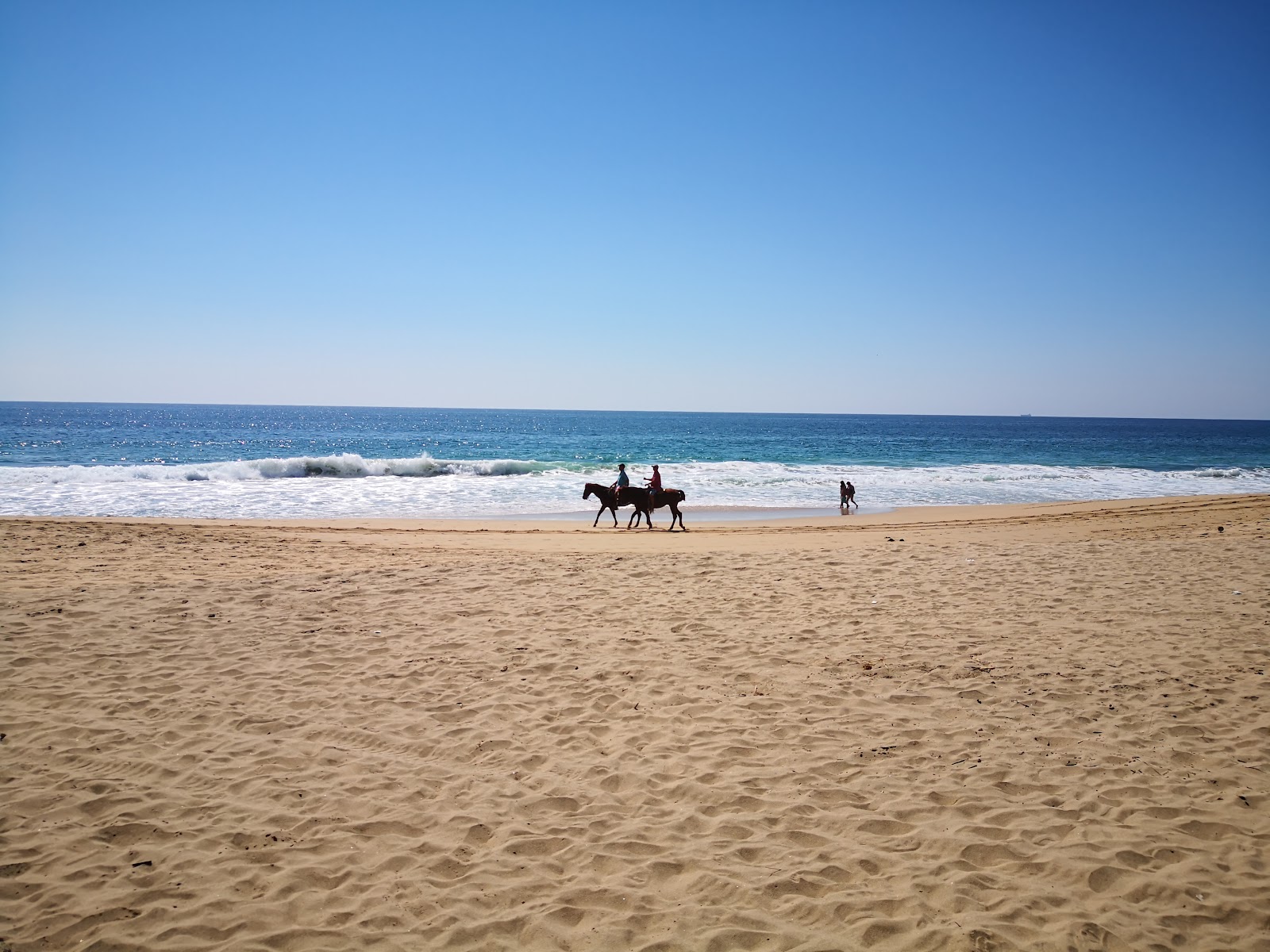 Foto av Playa Pie de La Cuesta och bosättningen