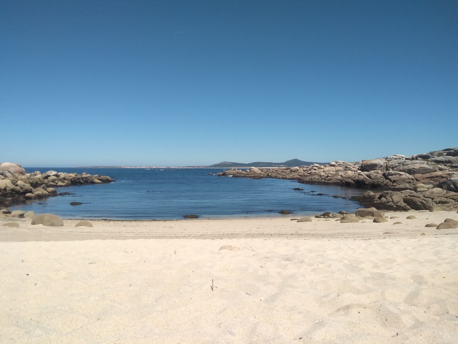 Foto van Area Basta beach met wit zand oppervlakte