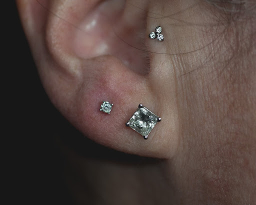 Explore anime tattoo ideas for guys, creative tattoo ideas in Buffalo, available at Moria Piercing and Jewelry