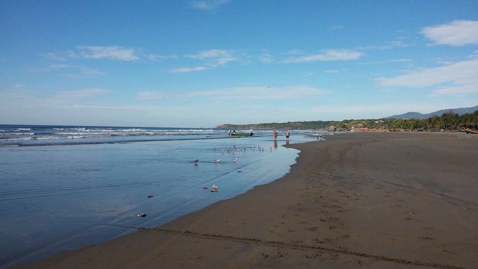Photo of El Cuco beach with long straight shore