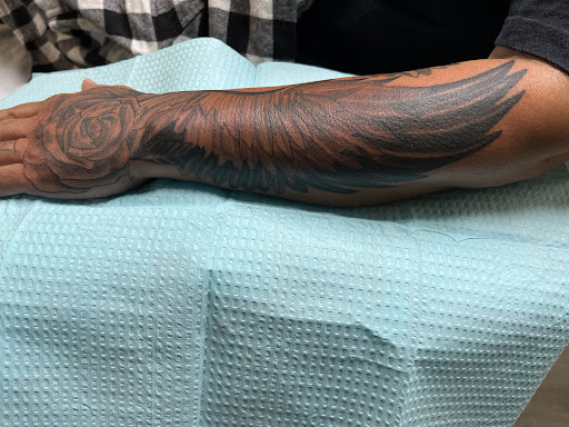 Explore paw print tattoo ideas, creative tattoo ideas in Spokane, available at Platinum Rose Tattoo Studio